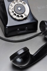 Old black telephone with rotary dial
