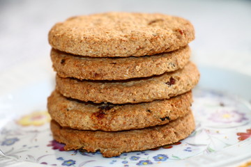 Fresh oatmeal cookies with seeds of cereals and raisins 