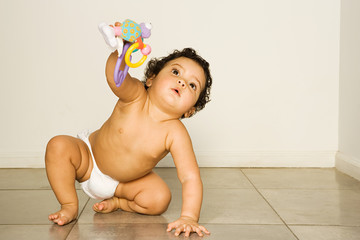 Baby holding toy