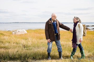 Mature couple walking on marshland