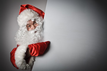 Santa Claus is pointing