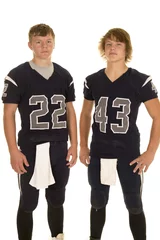 Fotobehang two football players standing next to each other with serious ex © Poulsons Photography