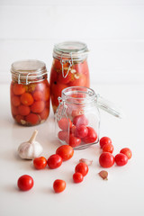 pots of marinated tomatoes