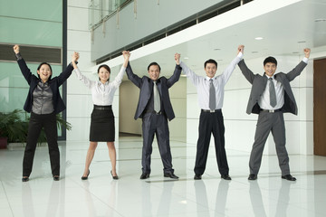 Obraz premium Business Team with Arms Raised