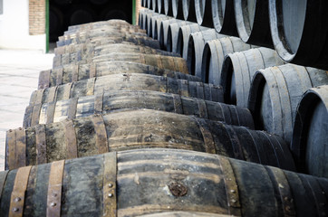 Barrels for whiskey or wine stacked in outdoor