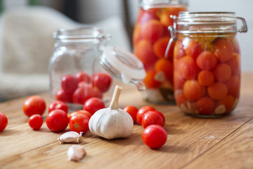 pots of marinated tomatoes
