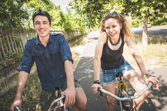 Couple relaxing after a ride in the park with bicycles. Healthy