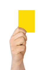 Hand holding a yellow card