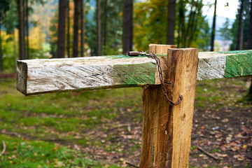 Closed with lock barrier bar gate in the forest