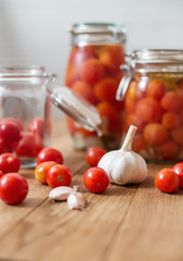 pots of marinated tomatoes