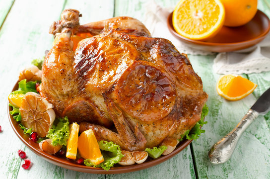 Whole roasted chicken with oranges