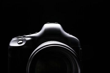 Professional modern DSLR camera low key image