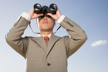 Businessman with binoculars