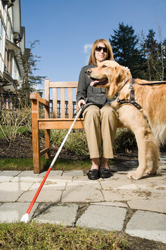 Blind woman with a guide dog