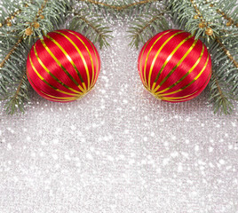 Christmas ornament and fir tree on shiny sparkling background