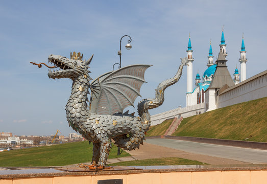 Kazan. Sculpture fabulous animal Zilant dragon at the entrance to the subway on the background of the Kazan Kremlin