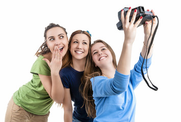 Three Young Positive Smilig Caucasian Ladies Making Self Photographs