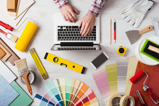 Professional decorator working at desk