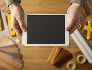 Craftsman holding a digital tablet