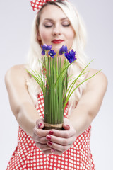 Pinup Caucasian Woman Holding Bunch of Vivid Lilac Flowers In Front