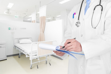 Obraz na płótnie Canvas Doctor writing a medical prescription with medical background