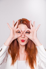 Portrait of a young attractive woman with red hair, isolated on white