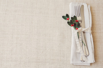 Christmas table place setting, holidays copy space background, selective focus, vintage tone