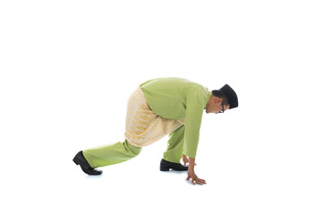 traditional malay male preparing to sprint