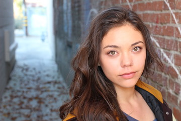 Beautiful young multicultural woman outdoor portrait.