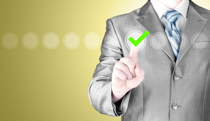 business man touching, pressing modern button with green ticking Check Box