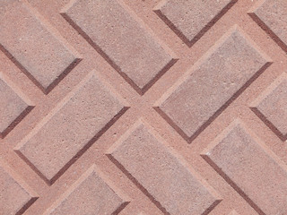 Red brick paving stones on a sidewalk