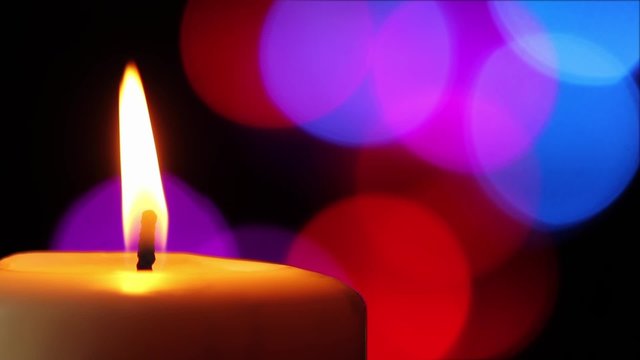 Loop - Candle and Colorful Lights in soft-focused background