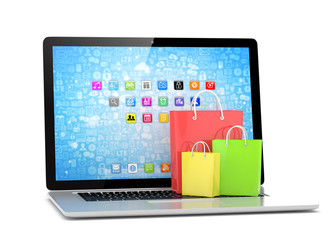 laptop and  shopping pags on white background