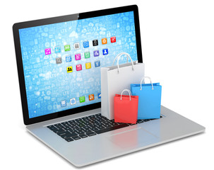 laptop and  shopping pags on white background