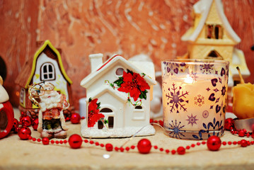 Christmas ceramic houses, Santa Clause and candle 