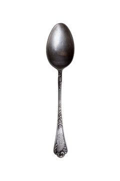 Old silver spoon on white background.