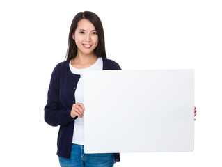 Asian woman showing blank whiter poster