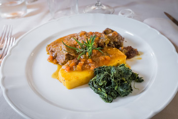 Osso buco made with polenta and spinach