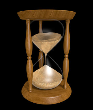 Sand trickling down an old wood hourglass as time passes
