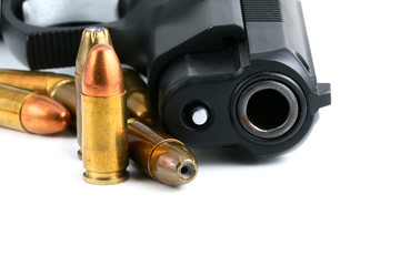 Black handgun isolated on a white background.