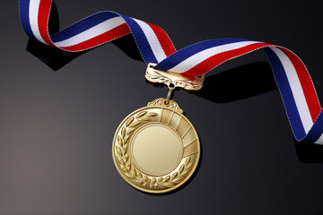 Gold medal on black background