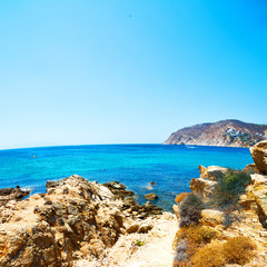 Fototapeta na wymiar in greece the mykonos island rock sea and beach blue sky