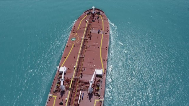 Cargo ship in open sea aerial shot