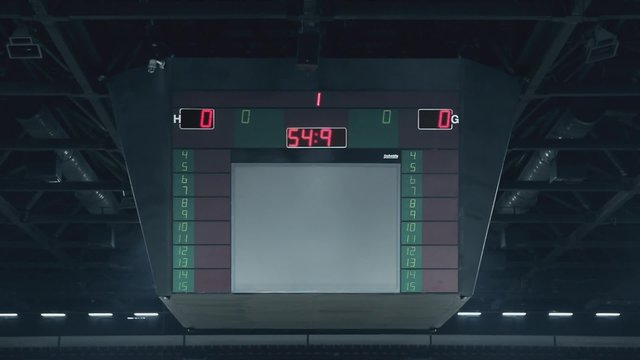 Scoreboard counting the last minute in an empty basketball arena