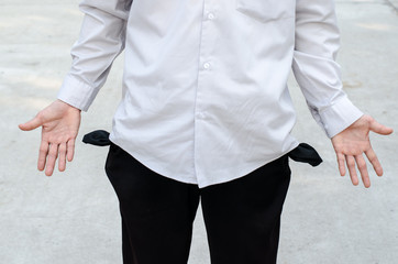 Business man showing his empty pocket