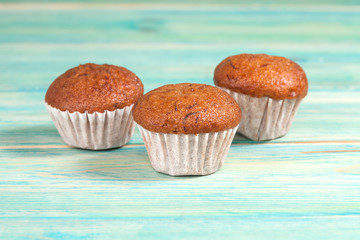 banana cup cake on wood deck .