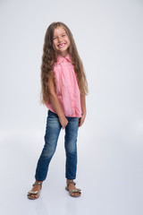 Full length portrait of cheerful little girl