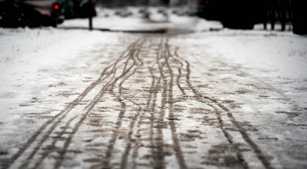 footprints on the snowy sidewalk