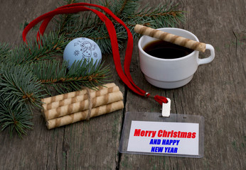 fir-tree branch with Christmas tree decorations, coffee and a la
