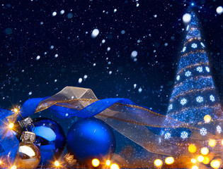 art Christmas background with a christmas ornament on blue backg
